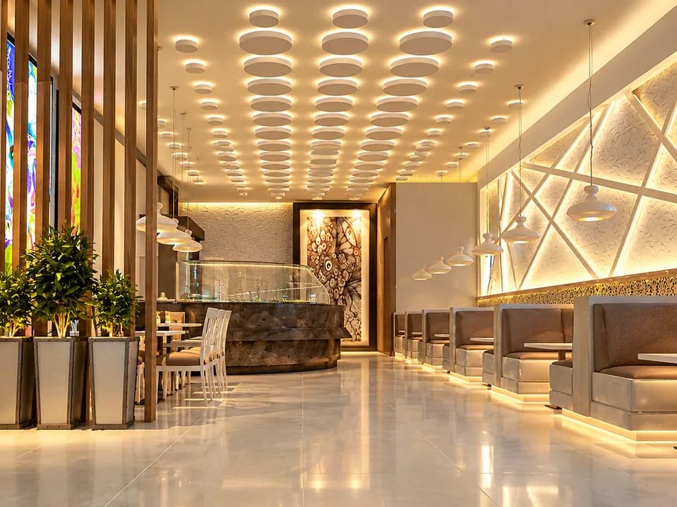 Askari Tower Lahore interior with circular ceiling lights and booth seating.