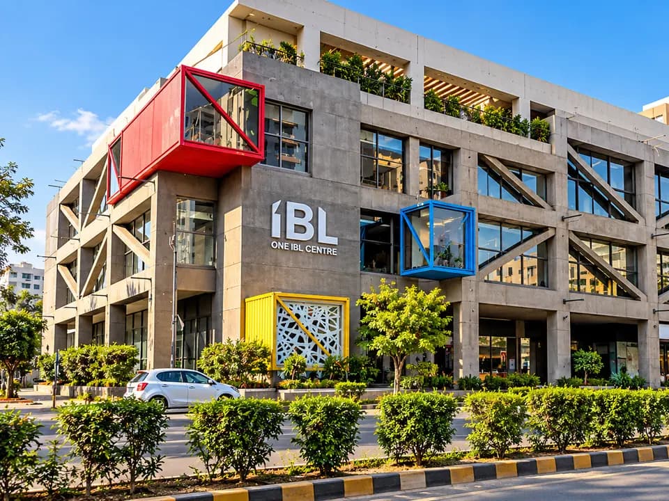 One IBL Centre façade in Karachi with concrete frame and coloured projecting volumes.