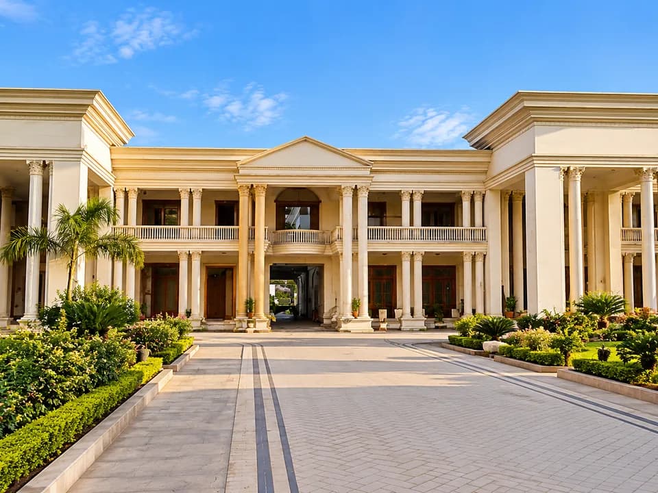 Classical colonnaded residence façade and driveway at CM House, Islamabad.